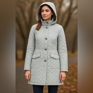 Women’s size large light gray quilted and hooded coat. Full button front.
